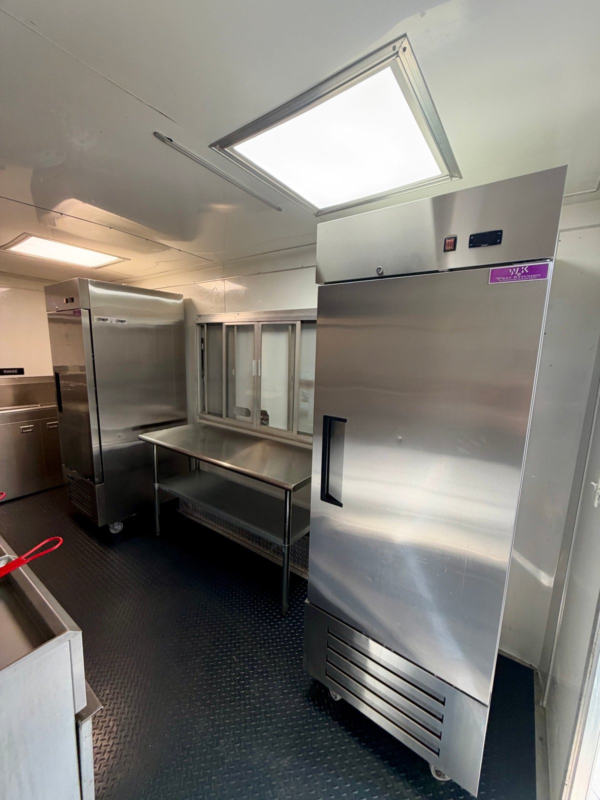 Pre-owned black 8.5 × 16 ft trailer — One-door refrigerator and freezer