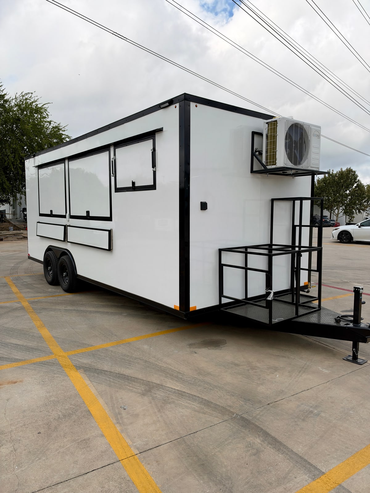 White 8.5 × 20 ft trailer — Front and service-side exterior