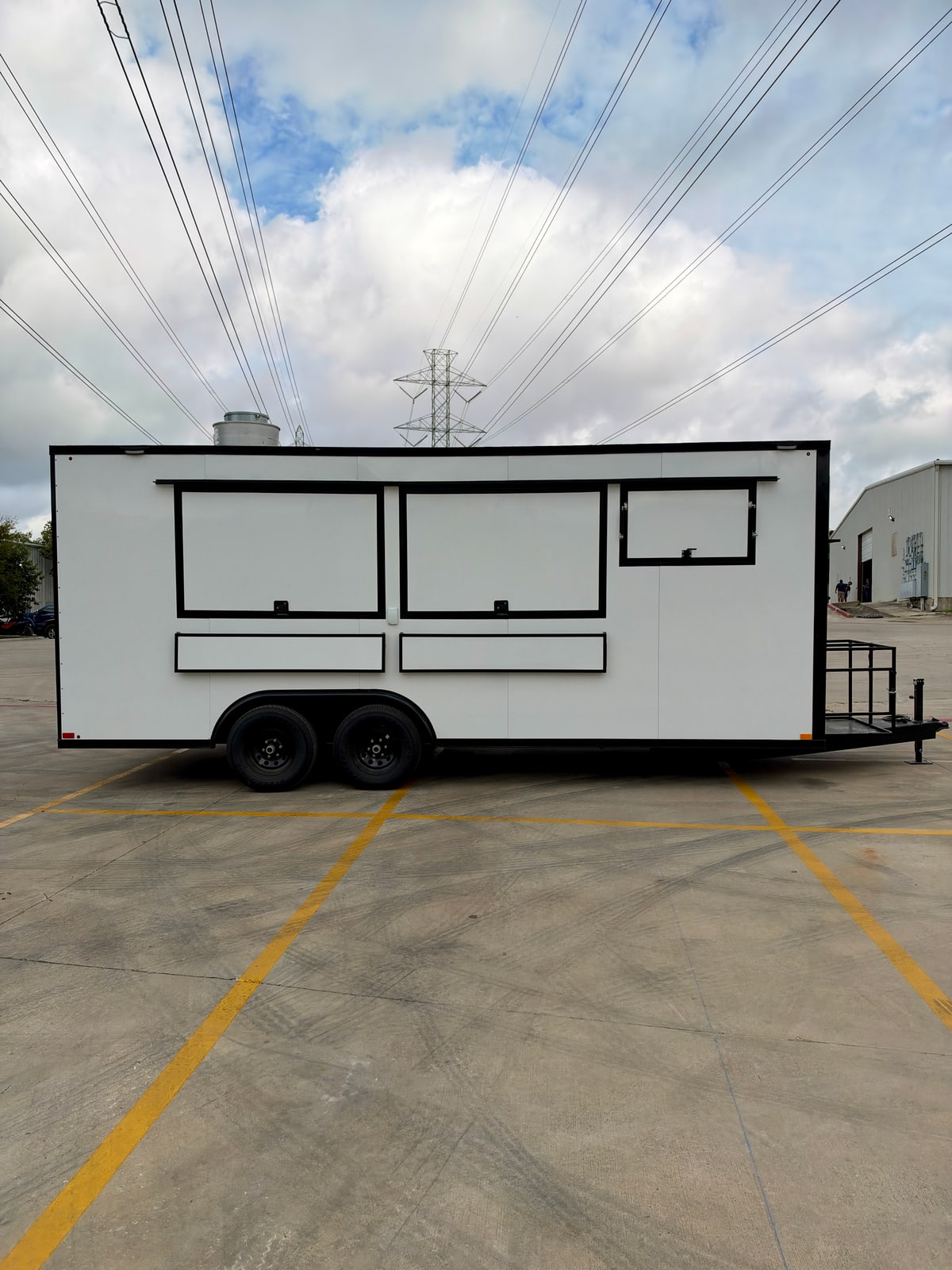 White 8.5 × 20 ft trailer — Service-side exterior