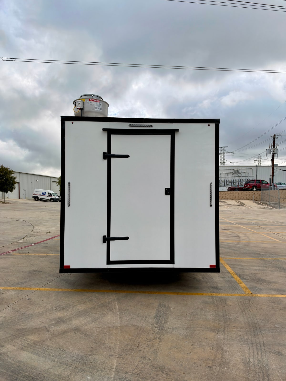 White 8.5 × 20 ft trailer — Rear entry door