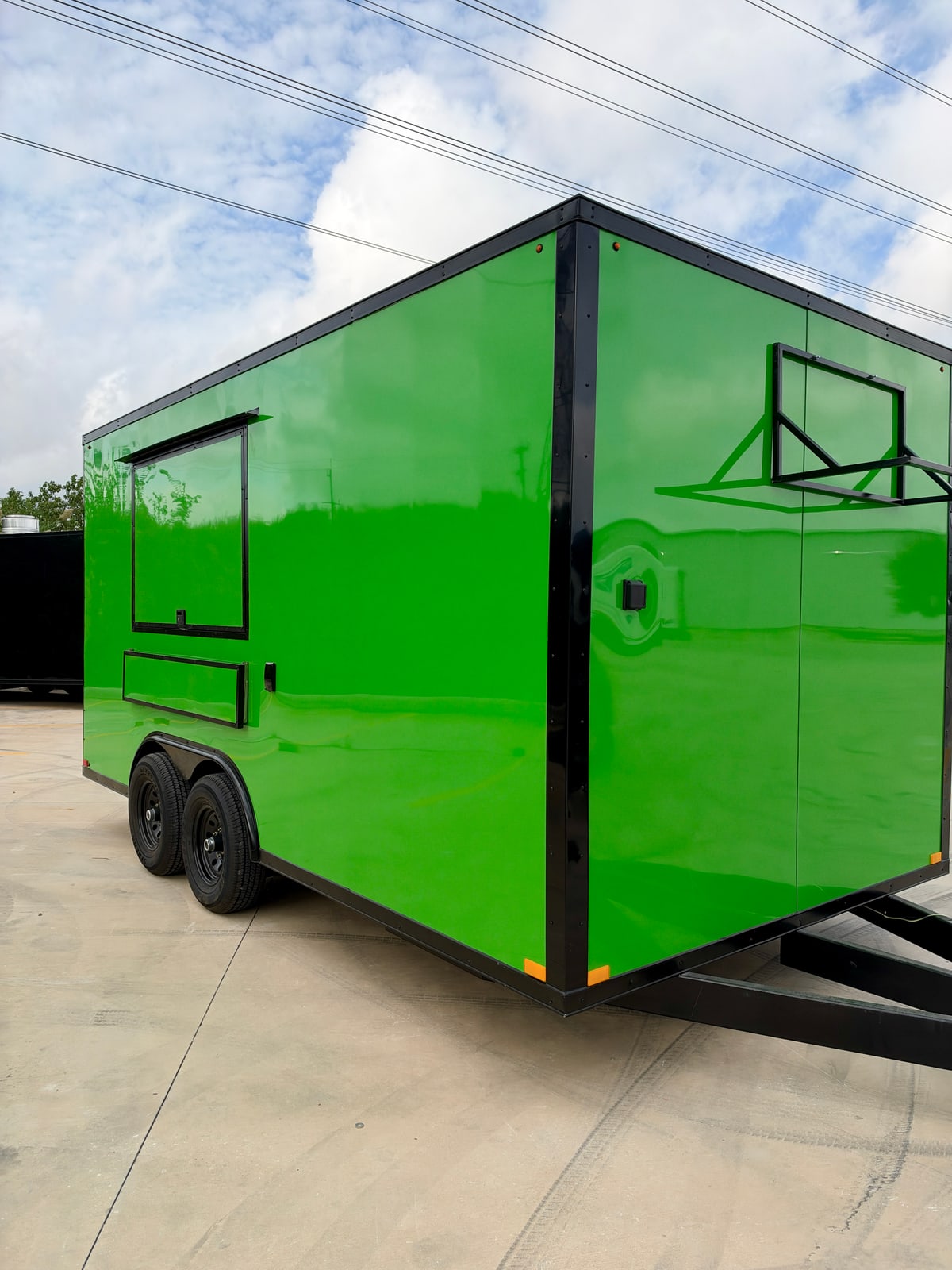 Green 8.5 × 16 ft trailer — Front and service-side exterior
