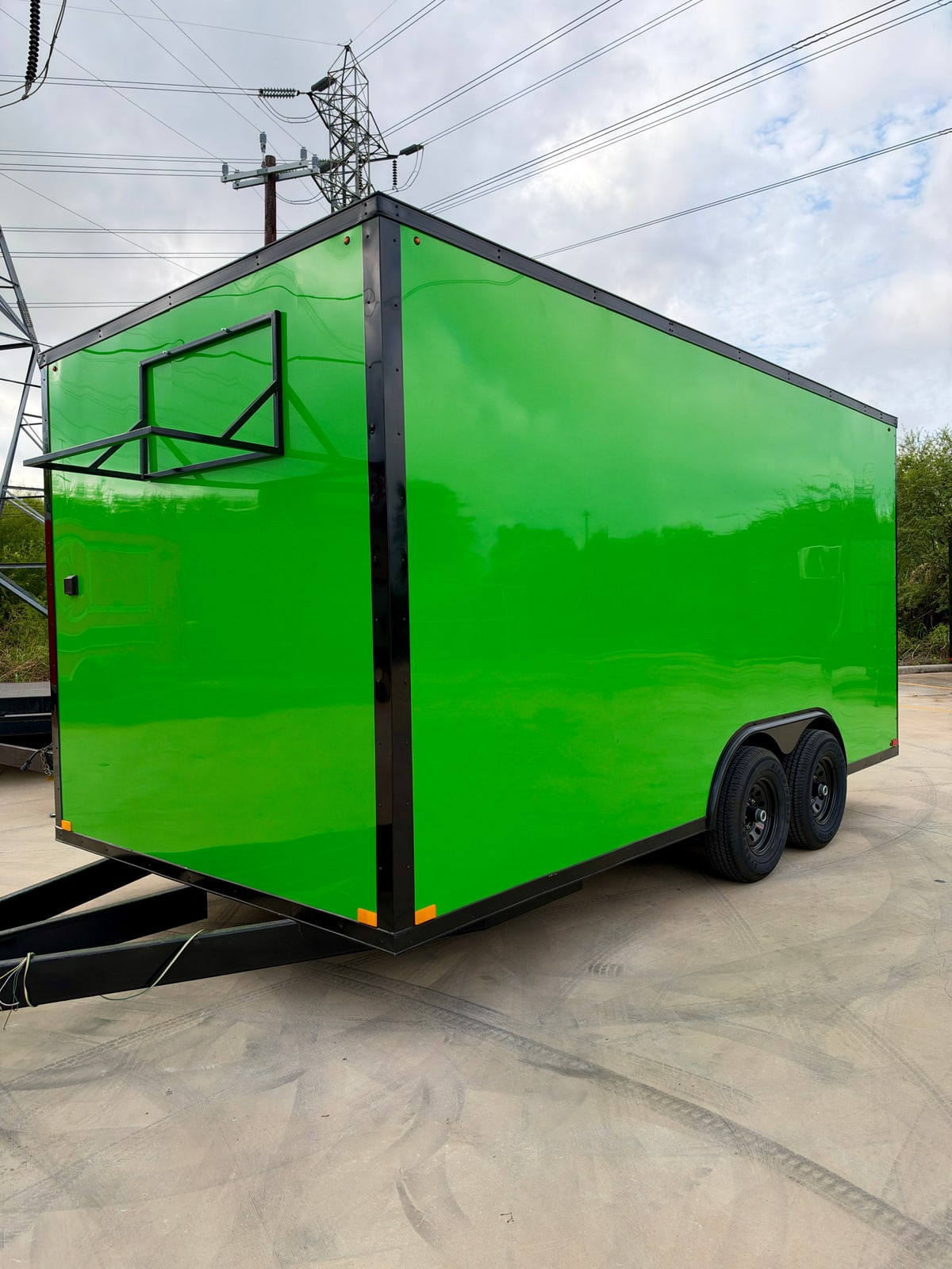 Green 8.5 × 16 ft trailer — Front and opposite-side exterior