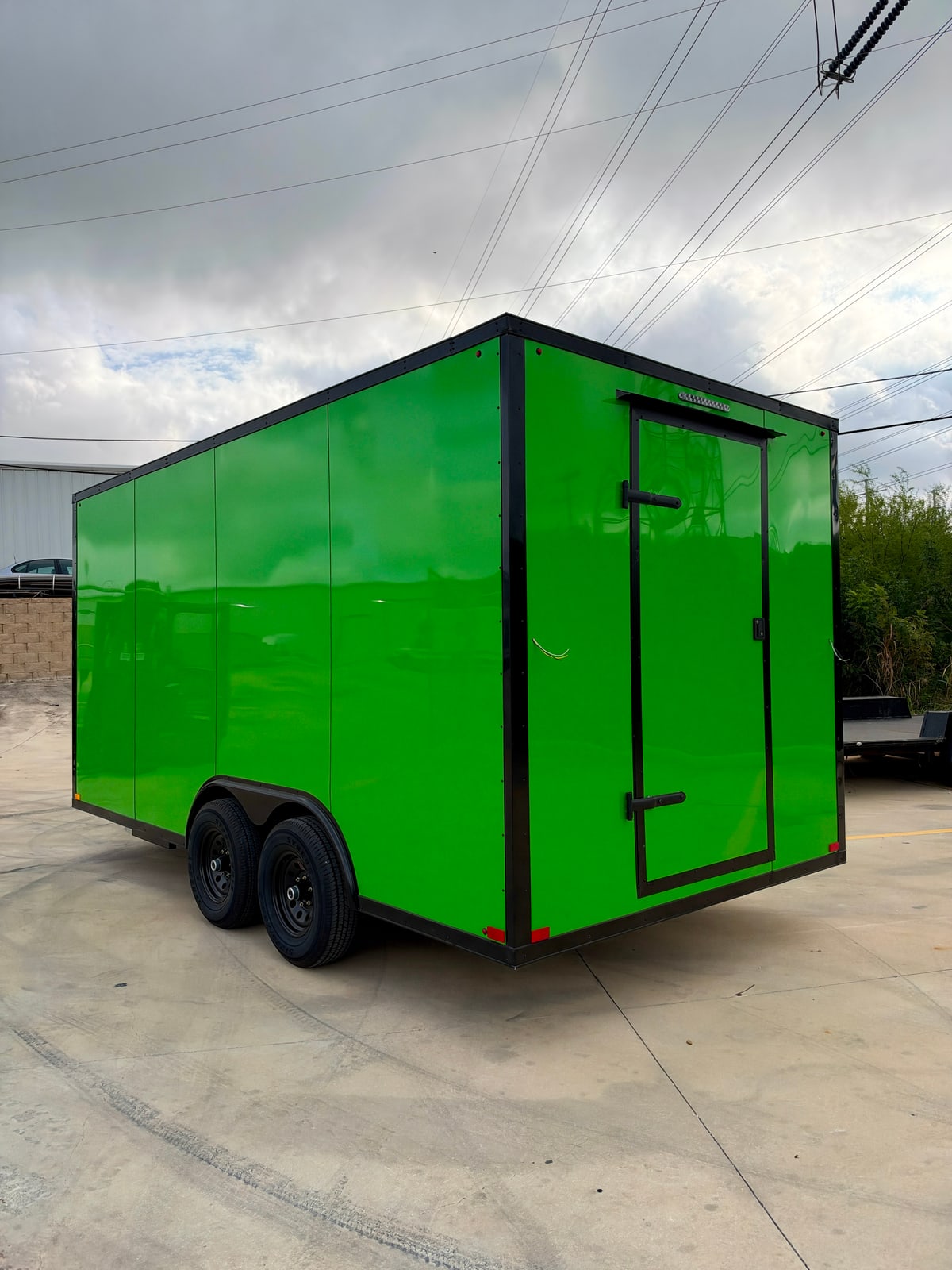 Green 8.5 × 16 ft trailer — Rear and opposite-side exterior