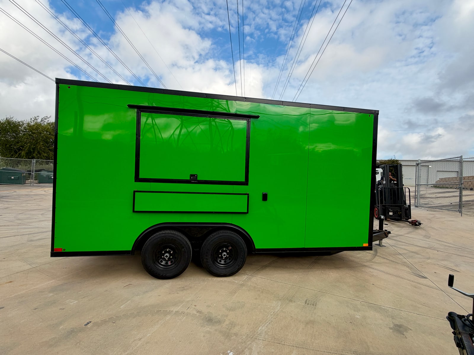 Green 8.5 × 16 ft trailer — Service-side exterior